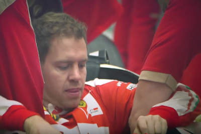 Sitzprobe schon absolviert: Sebastian Vettel setzt sich in seinen neuen Ferrari, der heute präsentiert wird