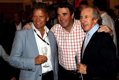 Marc Surer mit den Weltmeistern Nigel Mansell und Sir Jackie Stewart