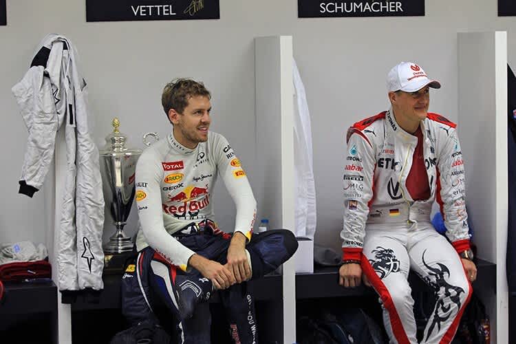 Sebastian Vettel 2012 mit Michael Schumacher