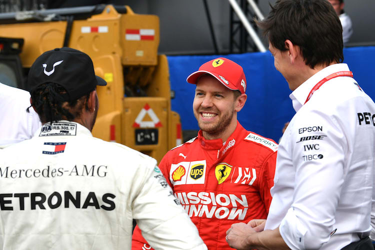 Lewis Hamilton, Sebastian Vettel und Toto Wolff