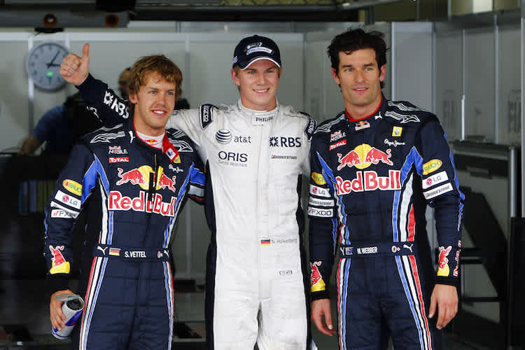 Nico Hülkenberg 2010 in Brasilien mit Sebastian Vettel (links) und Mark Webber (rechts)