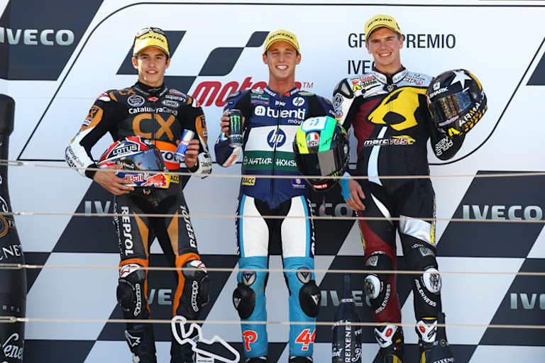 Man kennt sich: 2012 standen Márquez, Pol Espargaró und Scott Redding (v. li.) in Aragón auf dem Podest
