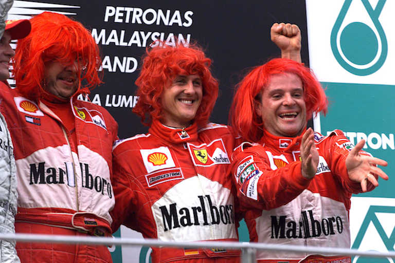 Ross Brawn, Michael Schumacher und Rubens Barrichello nach dem Malaysia-GP 2000